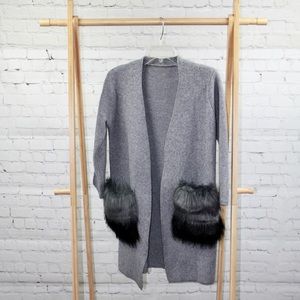 Sweater with fur pockets